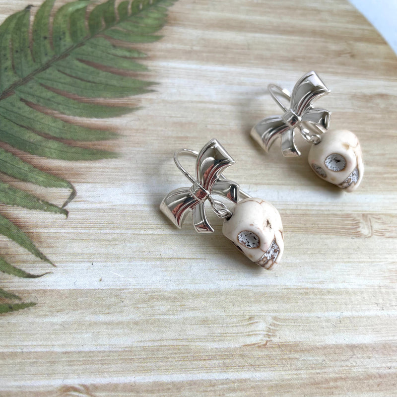 Skull earrings silver deals